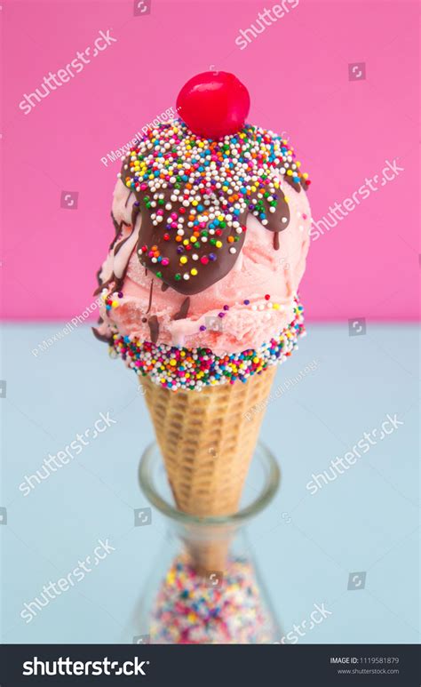 Ice Cream Cone With Sprinkles And Cherry