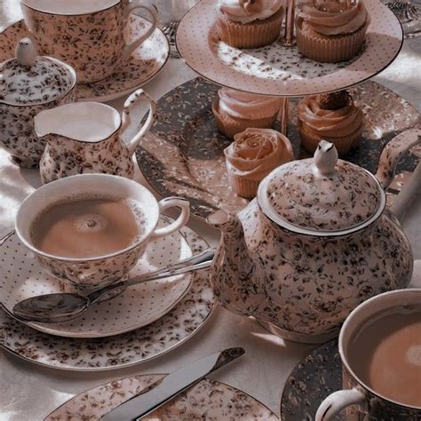 A Table Topped With Lots Of Cups And Saucers