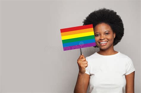 Happy Smiling African American Woman Holding Sign With Lgbt Flag On It