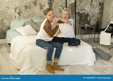 International Adult Relationships Two Gay Male Partners In Casual Clothes Resting Together In