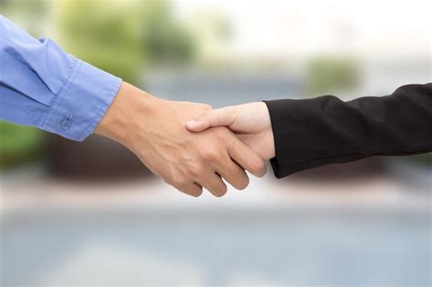 Premium Photo Cropped Image Of Business People Shaking Hands