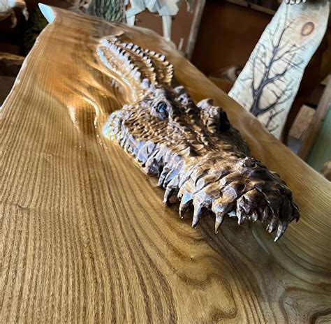 This Unique Bar Top Has Crocodile Emerging From The Wood