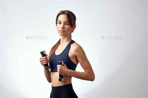 Woman With Dumbbells In Hands Workout Exercises Light Background Stock