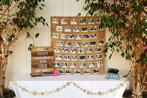 A Table Topped With Pictures And Trees Next To A White Table Cloth