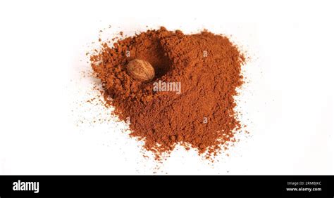 Nutmeg Myristica Fragans Nut Falling On Nutmeg Powder Against White