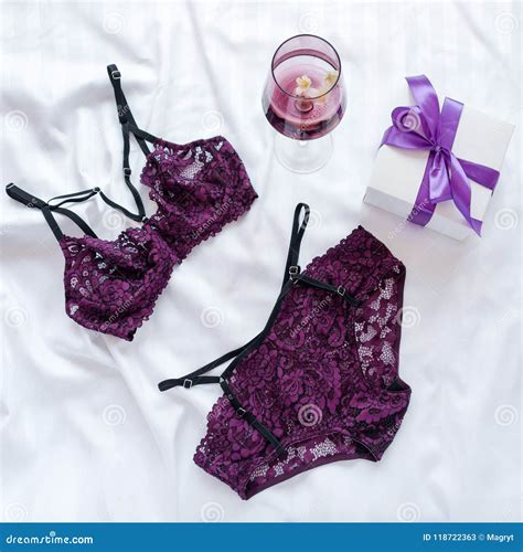 Gift Shopping And Fashion Concept Set Of Glamorous Stylish Lace Lingerie On Bed With Giftbox