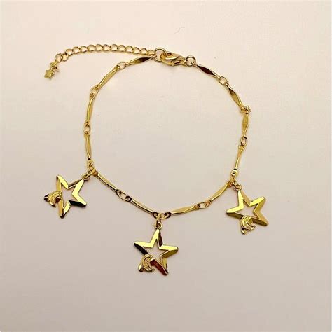 PULSEIRA FEMININA EM DETALHES DE ESTRELA E LUA FOLHEADA A OURO Rarah