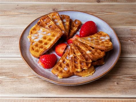 Premium Photo Freshly Baked Belgian Viennese Waffles Sprinkled With