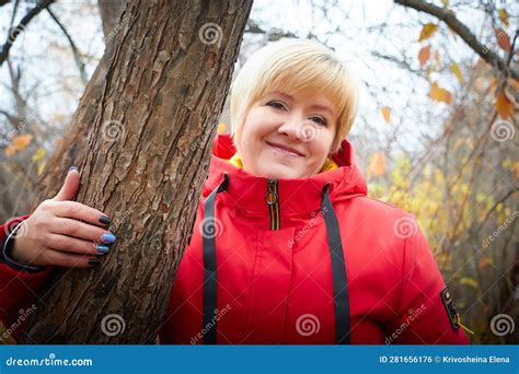 Blonde Adult Woman In An Empty Washington Subway Train Wearing Blue Jeans While Waving Her Hand