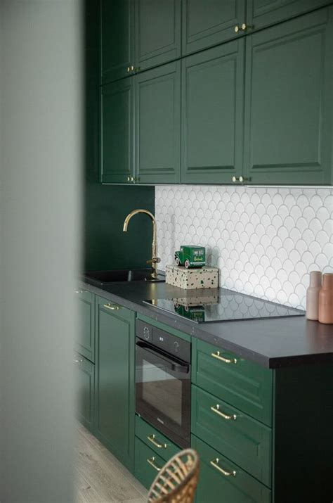Green Kitchen Cabinets and White Tile Backsplash