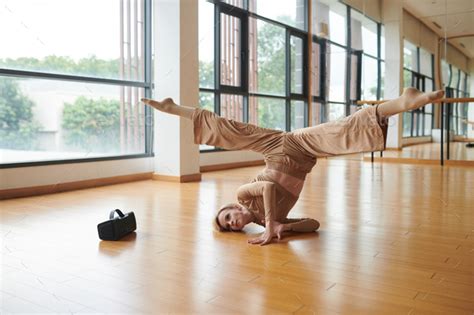 Dancer Doing upside down Splits Stock Photo by DragonImages | PhotoDune