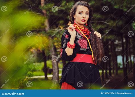 Brunette Girl In A White Ukrainian Authentic National Costume And A
