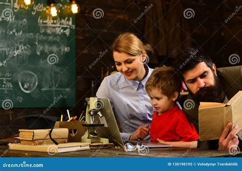 Mature Tutor Eacher Giving Private Lessons To Preschool Boy Teacher Drawing At Classroom In