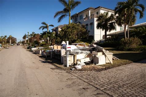 News â€“ Debris Including Personal Items Alongside Flooded Homes After