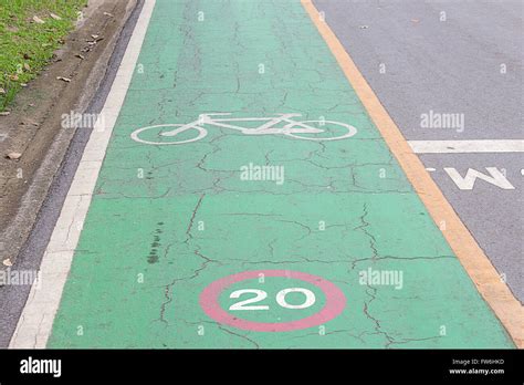 Bike Lane Signs Painted On To A Green Bike Lane Bike Lane Road For