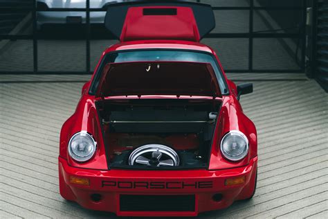 Red Porsche 911 Turbo S in the showroom. - Snappefy - Free Stock Photography