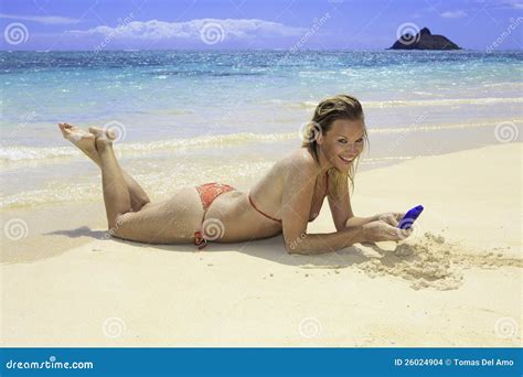 Blond In Bikini On Beach Texting Stock Photo Image Of Female Ocean