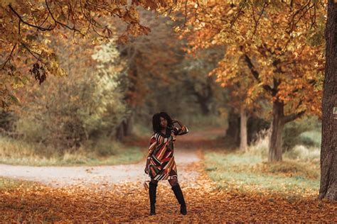 Model in Dress and Boots Posing in Autumn Park · Free Stock Photo