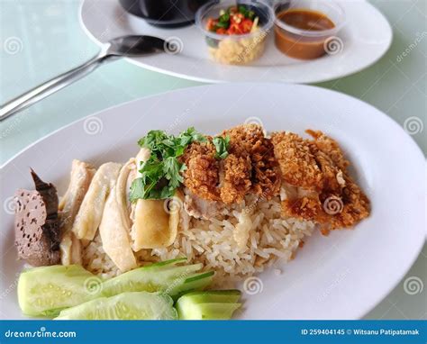 Steamed Rice Topped With Boiled Chicken Mixed With Fried Chicken Served