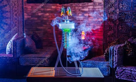 Hookah with color smoke on interior. — Stock Photo © Manowar1973 #54436097