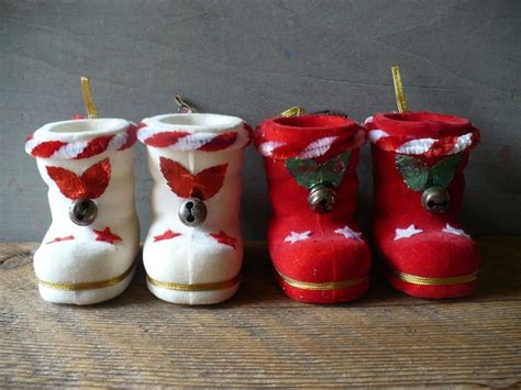 Three Pairs Of Red And White Christmas Boots