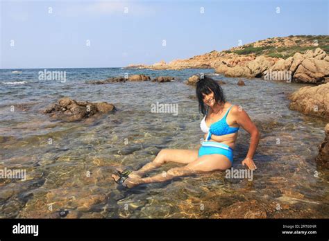 Old Woman In Bikini On The Rocks Stock Photo Alamy