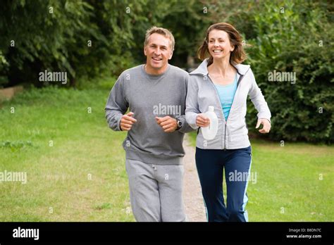 Mature Couple Jogging Stock Photo Alamy