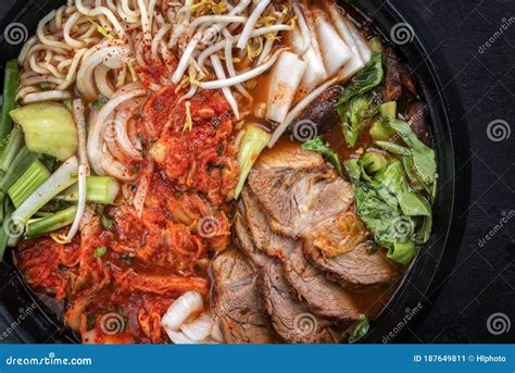 Traditional Korean Kimchi Jjigae with Grilled Pork Belly and Ramen in a ...