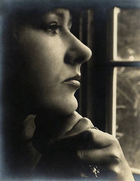 Black And White Photograph Of A Woman Looking Out The Window With Her