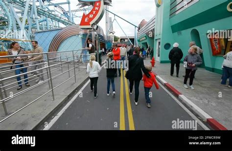 Amusement Park Excitement A Fairground With Carnival Rides And Happy