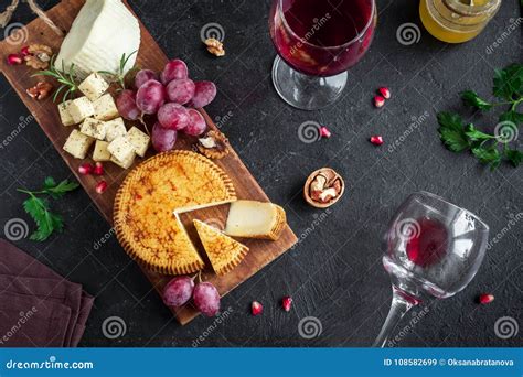 Cheese platter and wine stock image. Image of cheddar - 108582699