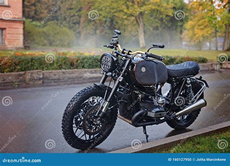 A Classic Motorcycle Parked On The Roadside Stock Photo Image Of