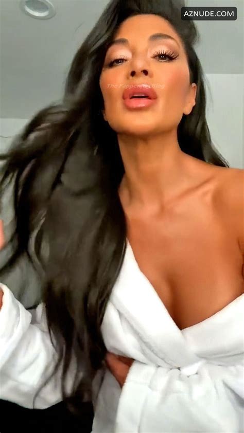 Nicole Scherzinger Sexy Shows Off Her Hot Cleavage In A White Robe Aznude