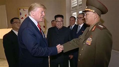 Trump seen in awkward exchange of salutes with North Korean general on ...