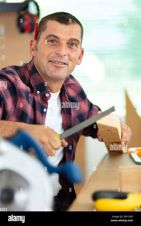 Carpenter At Work Polishing Wood Using Sander Stock Photo Alamy