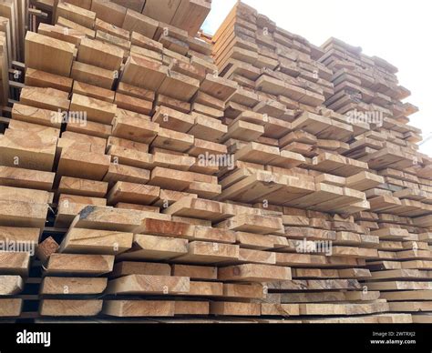 Stacked Timber Planks At A Lumberyard Awaiting Transportation Stacked