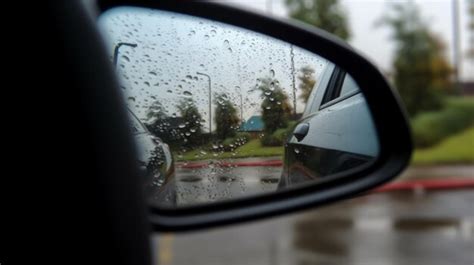 Premium AI Image | car mirror in rain view from window