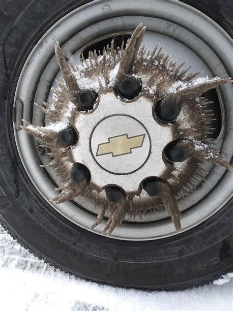 The way ice formed on the wheels of my work truck here in CO today : r