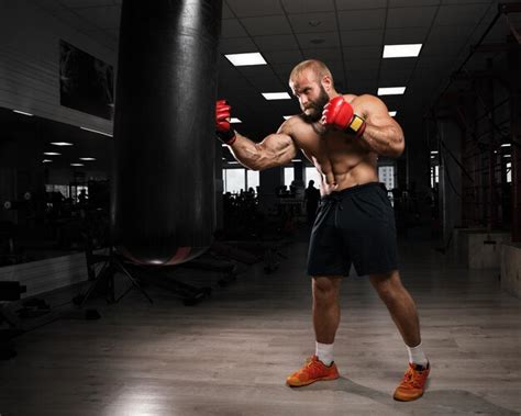 Premium Photo Strong Muscular Man Boxing At The Gym