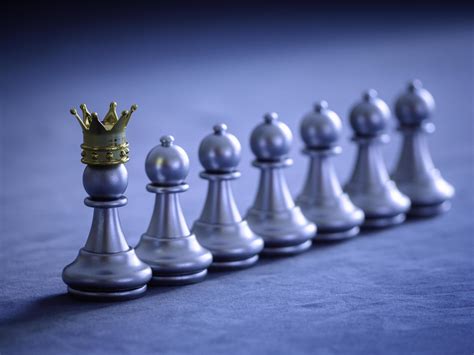 Silver Chess Pawn Wear Gold Crown To Leadership On Chess Board With