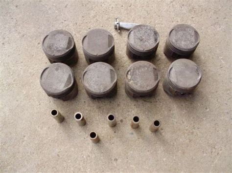 Sell 8 1957 392 HEMI CHRYSLER IMPERIAL PISTONS WITH 7 WRIST PINS USED