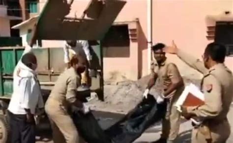 On Camera Uttar Pradesh Cops Caught Dumping Mans Body Into Garbage Van