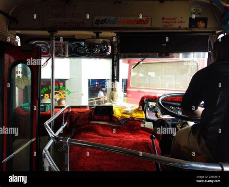 Bus station in Sri Lanka. Bus interior with buddha statue Stock Photo - Alamy