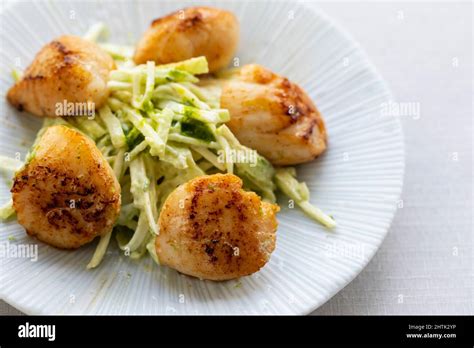 Pan fried scallops with celeriac salad Stock Photo - Alamy