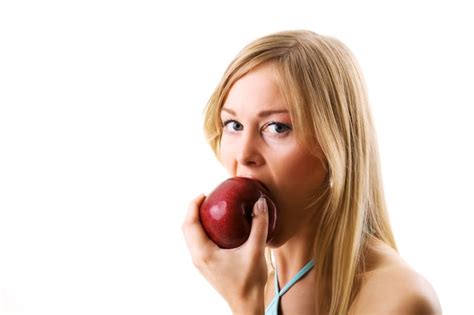 Premium Photo Blonde Girl Eating Apple