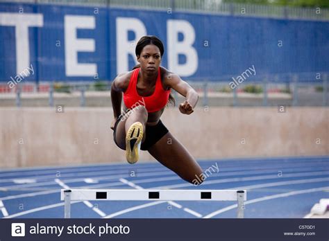 Girl Jumping Hurdle On Running Hi Res Stock Photography And Images Alamy