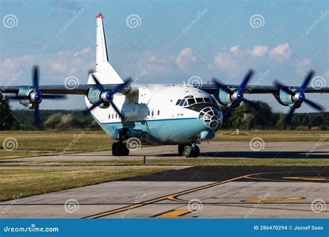 Cavok Air Antonov An 12 Cargo Plane At Airport Apron With Marshaller