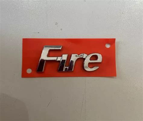 Emblema Sigla Fire Tampa Traseira Fiat Palio 01 17 46792656