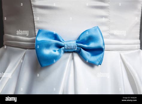 Blue Bow On White Wedding Dress Closeup Stock Photo Alamy