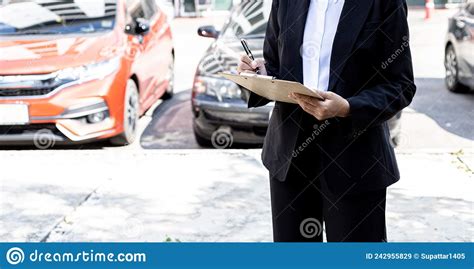 A Person Holding A File A Female Employee Of A Car Rental Company Is About To Deliver The Car